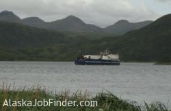 Floating Processor anchored in bay in Alaska processing salmon for the fishing fleet photo